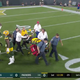 Illustration for article titled Jamaal Williams Taken Off On Stretcher Following Brutal Late Hit From Derek Barnett